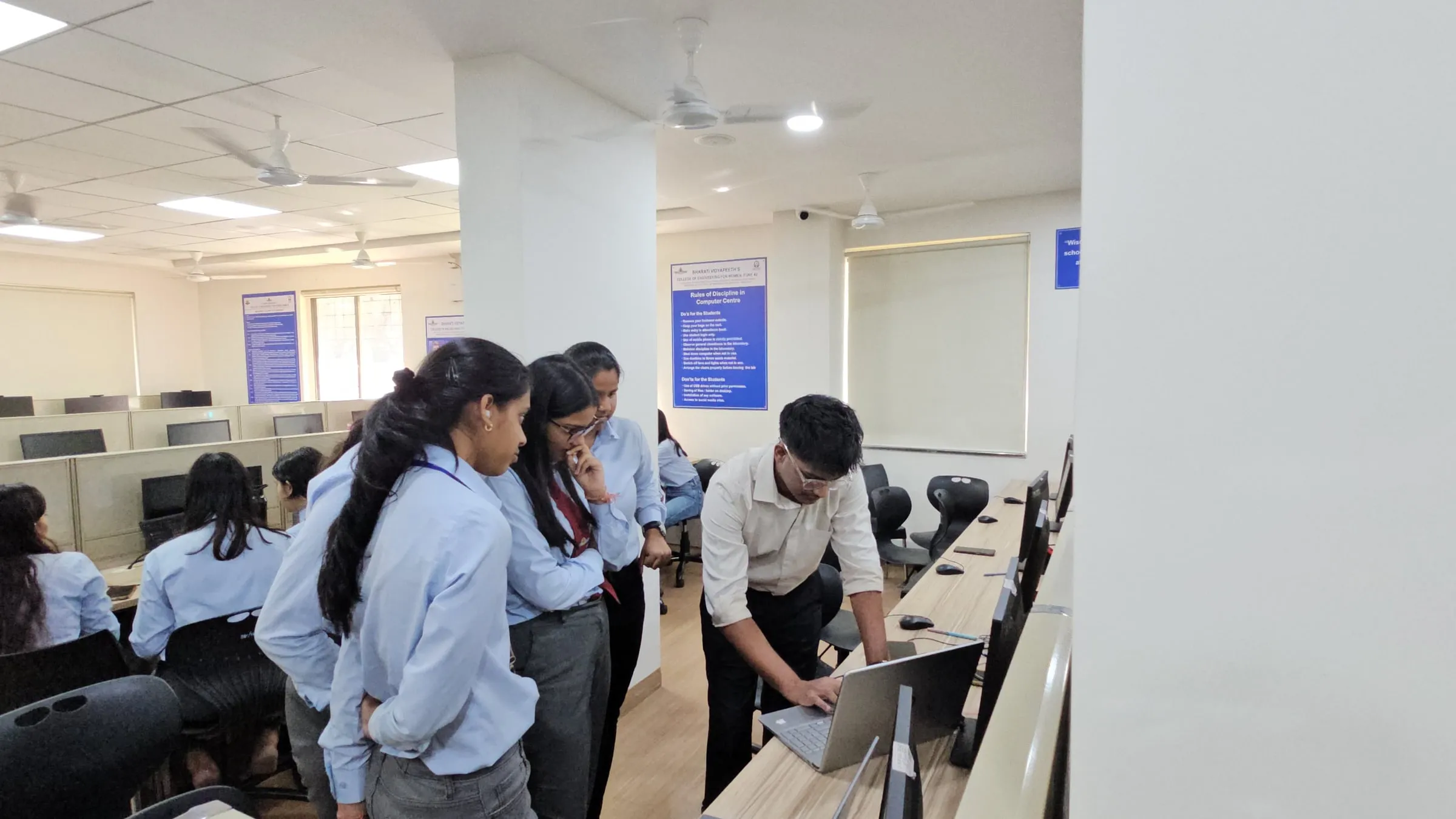 Students working through a hands-on exercise at their computers during a workshop